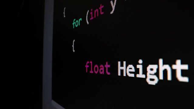 Closeup macro shot movement of coding script moving across LED screen with real-time AI-generated typing, showcasing advanced AI learning in optimization, debug and coding for software development.