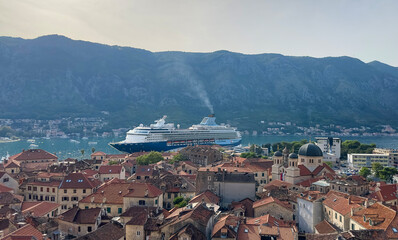 Cruise ship. Panorama of the city of Kotor with a liner near the bay, Montenegro. View from the top observation deck 