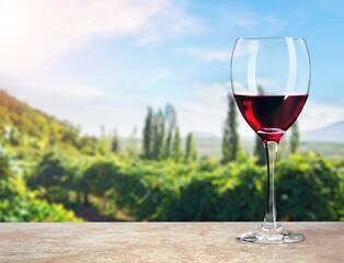 Glass of tasty alcohol wine on the hills