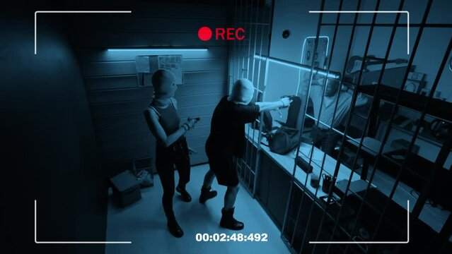 CGI high angle stab CCTV shot of armed young delinquent couple robbing pawnshop and detecting surveillance camera