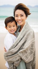 Asian mother and son having fun together on the beach