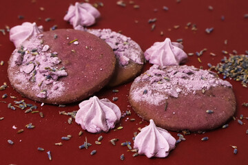 Lavender cookies and little marshmallows with lavender flowers on the edges. Close-up	