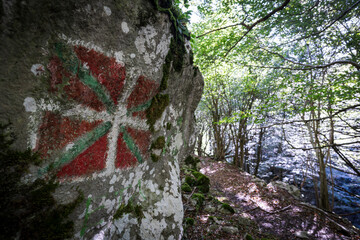 Basque flag painted on the rock, ikurrina, GR 20 trail - Circular route to Aralar, Aralar natural...