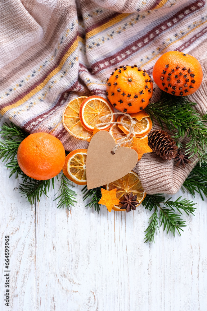 Wall mural christmas holiday background. knitted sweater, fresh citrus fruits decorated cloves, dry orange slic