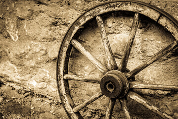 Fototapeta na wymiar antique wooden wheel - close up