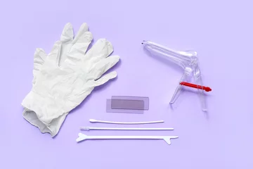 Fotobehang Medical gloves with gynecological speculum and pap smear test tools on lilac background © Pixel-Shot