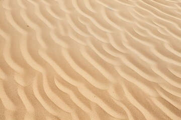 Fototapeta premium Closeup of sand pattern of a beach in the summer.