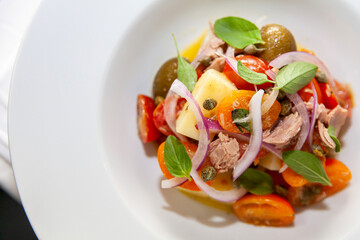 Tuna and vegetables dish close up top view