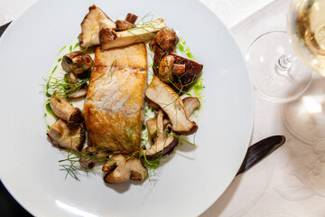 Scandinavian fish and mushrooms dish top view close up