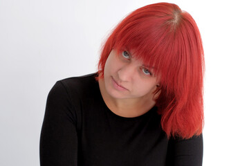 A young attractive woman with a short orange hairstyle