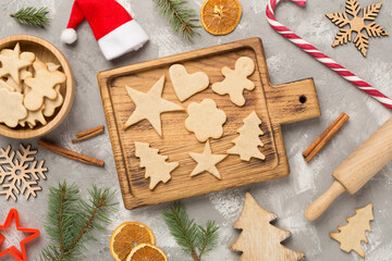 Flat lay with cute homemade Christmas cookies on concrete background,top view