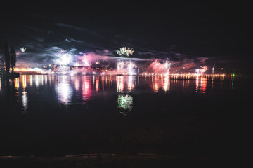 New Year eve midnight firework exploding over the broadwalk of Peterhausen photographed from the...