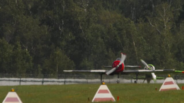 Retro plane flies at airshow. Two-seat sports trainer aircraft, designed for initial training and training of pilots. Soviet plane Yakovlev