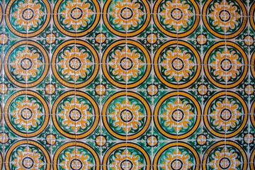Traditional colorful Spanish ceramic tiles on a wall in Spain
