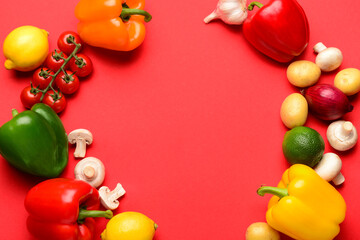 Frame made of fresh vegetables and fruits with mushrooms on red background