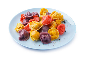Plate of boiled colorful dumplings with peppercorn on white background