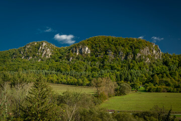 Meadows and hills in Strazovske hills in autumn cloudy day with green colors