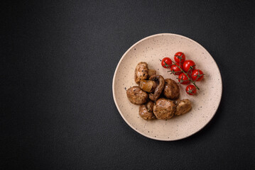 Delicious juicy whole champignons baked on the grill with salt and spices