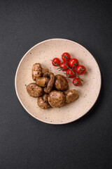 Delicious juicy whole champignons baked on the grill with salt and spices