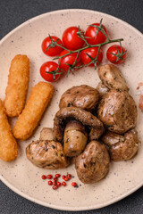 Delicious juicy whole champignons baked on the grill with salt and spices