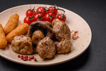 Delicious juicy whole champignons baked on the grill with salt and spices
