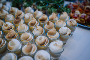 For a delightful small appetizer, consider serving tiramisu in a glass, with a side of iced coffee and a scoop of ice cream on a plate.