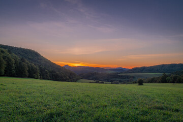 Fototapeta na wymiar Meadows and hills in Strazovske hills in autumn evening near Podskalie village