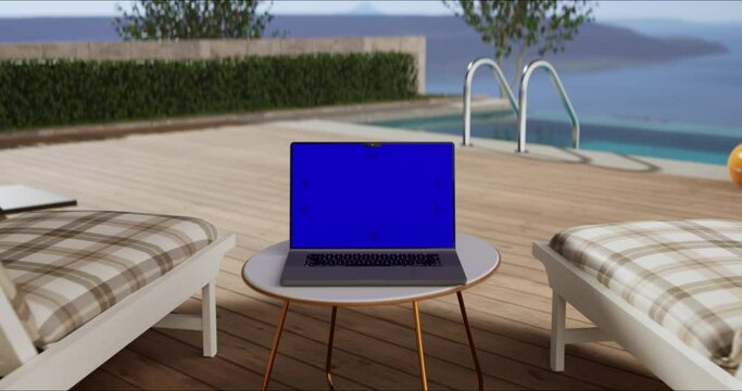 Swimming pool with beach lounge chair sun bed on the wooden deck and sea view. Laptop place on table, blue screen display, Close up monitor of notebook with mock up