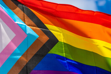 Progress pride flag flying - obrazy, fototapety, plakaty