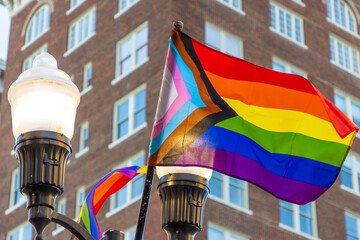 Progress pride flags in city - obrazy, fototapety, plakaty