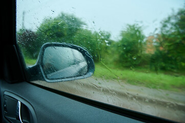 passengers window of the car during rain