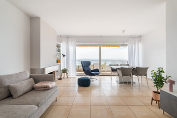 Living room with fireplace and large terrace in apartment