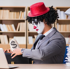 Clown businessman working in the office