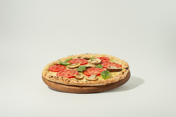 Pizza margherita on a board isolated on a light background
