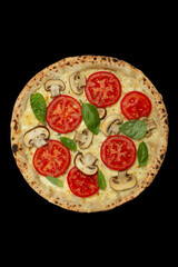 Pizza margherita on a board isolated on a dark background