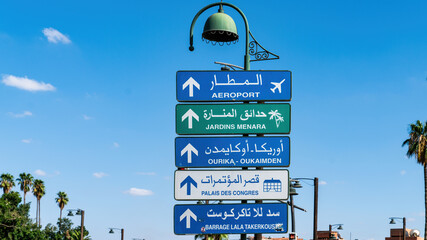 Traffic sign showing the direction for Marrakesh airport in city center, Morocco