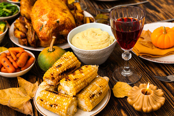 Festive dishes for Thanksgiving Day on dark wooden background, closeup
