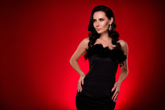 Photo of tempting slim lady wear sexy dress enjoying choosing new glamour look isolated dark red color background