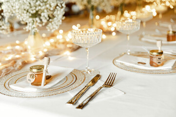 Wedding banquet decorations. Wood rustic style decor. Festive table with desserts, snacks, cakes, blackberry and popcorn. Receptions Tarlets. Decorations made of wood with flowers and greenery.