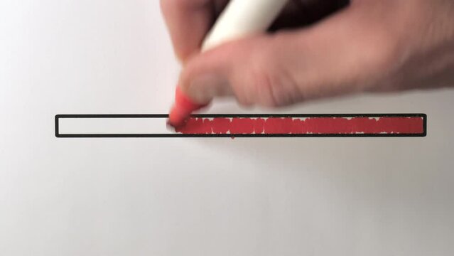 The red full bar of the loading bar on an animated concept idea then draining the progress. Hand moves the red felt-tip pen rapidly. The background is a white sheet of paper. Vertical Format Video 