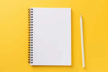 Keuken spatwand met foto spiral bound yellow notebook and pencil. Generative AI © Hawthorn