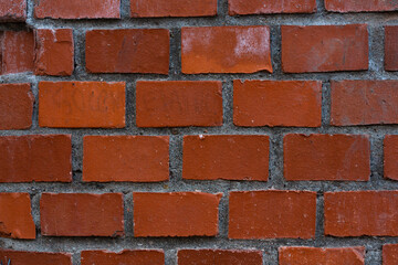 Red brick wall. The texture of the brickwork. Background masonry.