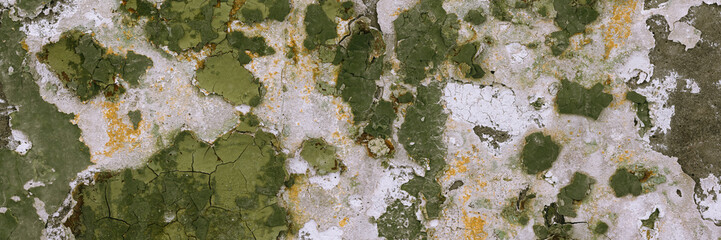 Peeling paint on the wall. Panorama of a concrete wall with old cracked flaking paint. Weathered rough painted surface with patterns of cracks and peeling. Grunge texture for wide panoramic background