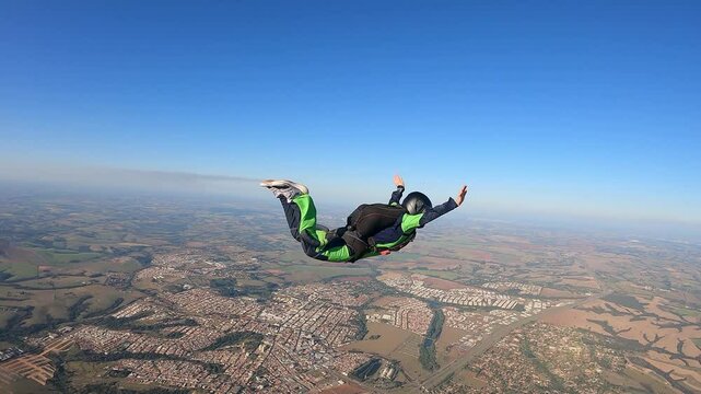 Daring Female Skydiver Jumping from Plane, Inspiring Freefall Dive, Clear Blue Sky and Cloudscape