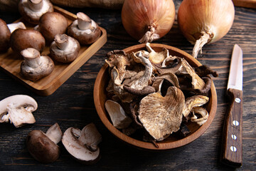 slices of different dried mushrooms in a wooden bowl as gourmet food ingredients, Vegetable organic...