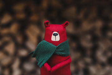 Christmas, New Year, Winter concept. Christmas toy bear on wooden logs