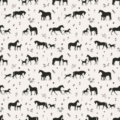 Newborn foals with mares in the meadow, seamless vector pattern