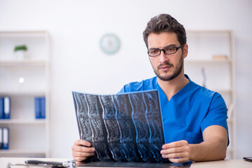 Young male doctor radiologist working in the clinic