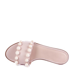Modern beige leather women's slide-in sandal decorated with large beads isolated on a white background. Creative design for shoe store advertising poster. Summer season footwear concept.