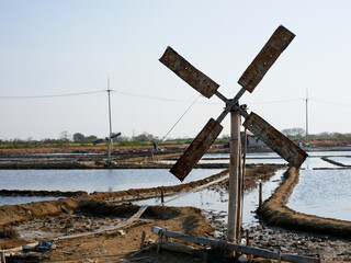 windmills in traditional salt ponds to regulate the flow of irrigation water